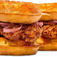 Chicken and Waffles Sandwich · Fried chicken, cheddar cheese, pickled onions, pepper jelly whiskey maple syrup.
