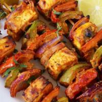 Paneer Tikka · Cottage cheese cubes delicately flavored to perfection.