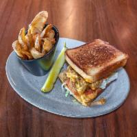 Louisiana Oyster Sandwich · Fried oysters, spicy remoulade, tomatoes, shredded lettuce, thick cut toast