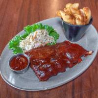 Baby Back Ribs-half rack · Spice rubbed, slow cooked ＆ char grilled, basted with old no. 7 bbq sauce, served with skin-...