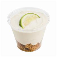 Key Lime Cheesecake Parfait · Key lime crème and cream cheese filling on a bed of oatmeal cookie crumbles, topped with a l...
