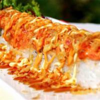 Cs17. Ocean Roll · Shrimp tempura, cream cheese, cucumber and crab fish salad on the top with eel sauce, white ...