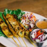 8. Chicken Satay · 4 pieces. Grilled Thai marinade chicken skewers served with peanut sauce and cucumber salad.