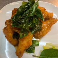 11. Peek Gai Tod · 7 pieces. Deep-fried chicken wings with Thai spicy basil sauce.