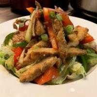 Lemongrass Chicken Salad · Grilled lemongrass chicken on Thai style lime juice dressing salad with garden greens, crisp...