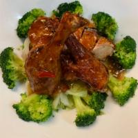 SP3. Kra Paow Duck · Crispy duck with basil sauce bedded with steamed broccoli, cabbage and carrot.