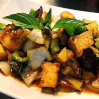61. Pad Phet Eggplant · Stir-fried Chinese eggplant with bell peppers, bamboo shoots, onion, basil in roasted red ch...