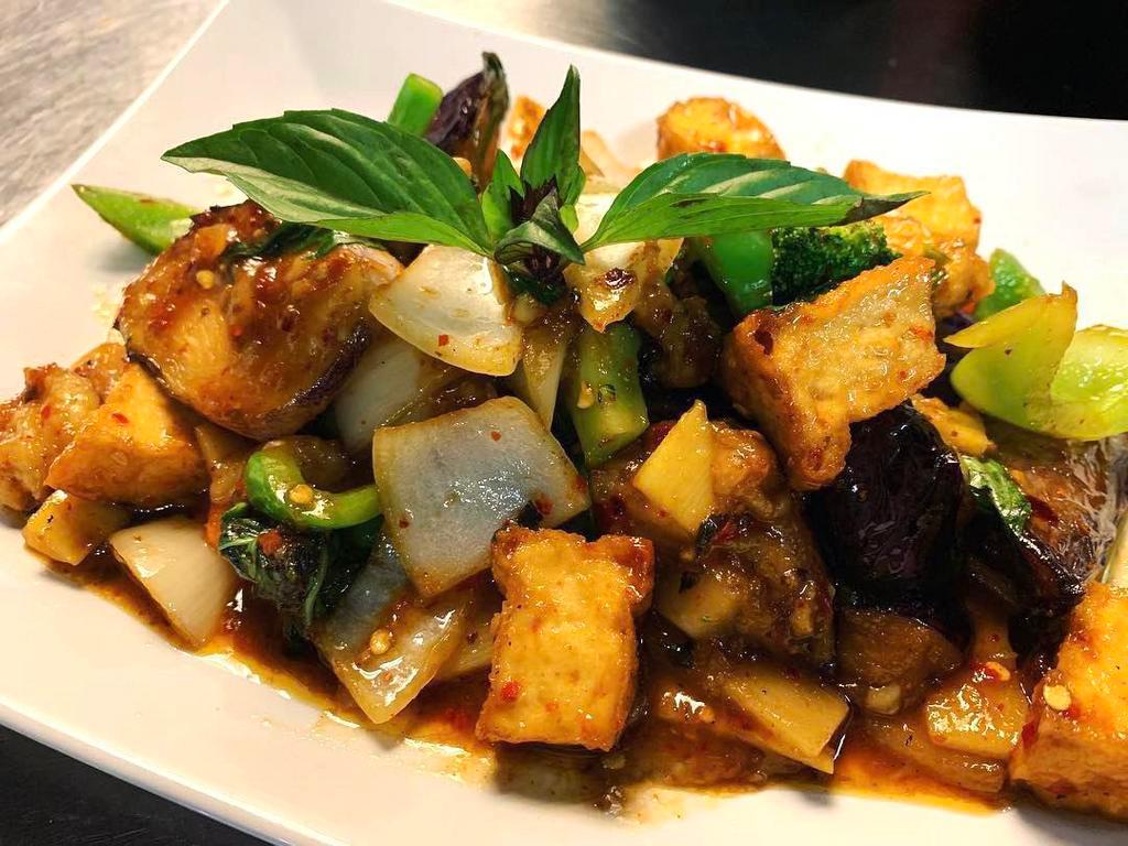 61. Pad Phet Eggplant · Stir-fried Chinese eggplant with bell peppers, bamboo shoots, onion, basil in roasted red chili paste sauce