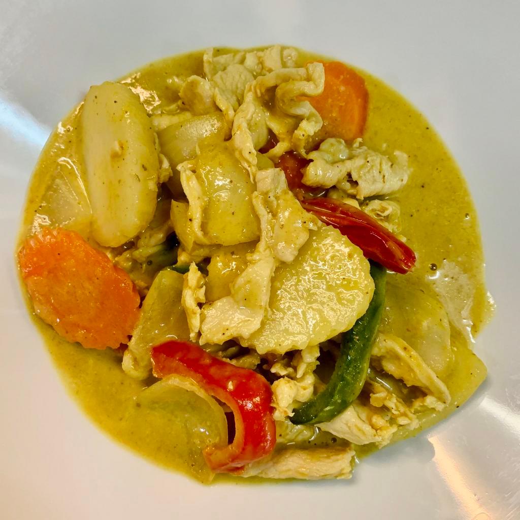 70. Yellow Curry · Thai yellow curry with coconut milk, onion, potato, carrot, bell peppers and sprinkle with shallots.