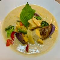 71. Green Curry · The most famous Thai green curry with coconut milk, bamboo, eggplant, bell pepper and sweet ...