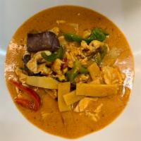 72. Red Curry · Thai red curry with coconut milk and eggplant, bell pepper, bamboo and Thai sweet basil leav...