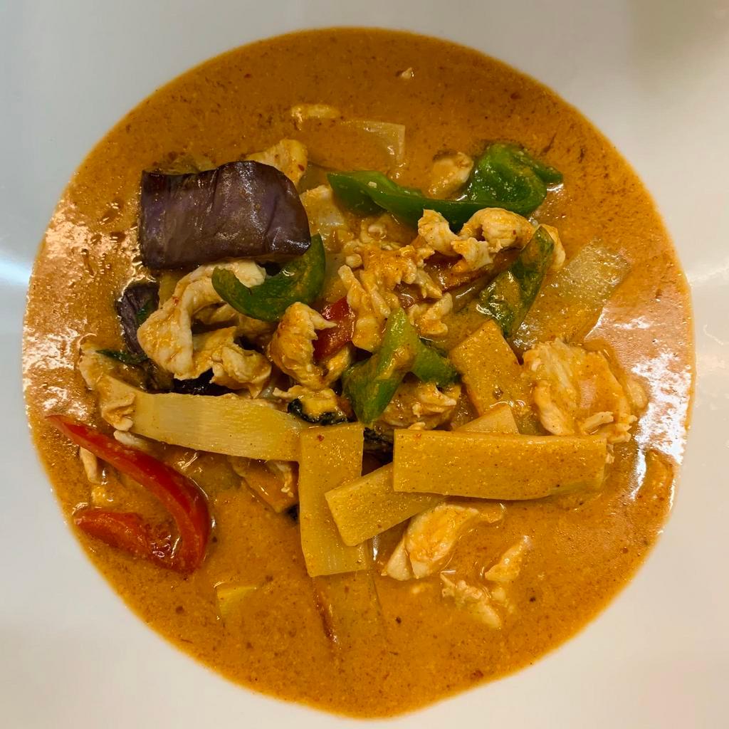 72. Red Curry · Thai red curry with coconut milk and eggplant, bell pepper, bamboo and Thai sweet basil leaves.