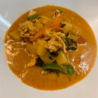 75. Pine Curry · Thai red curry with coconut milk with basil, pineapple, bell pepper and bamboo.
