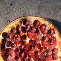 Doppio Pepperoni Pizza · Red sauce base topped with mozzarella, creamy ricotta, 2 types of pepperoni & oregano with a...