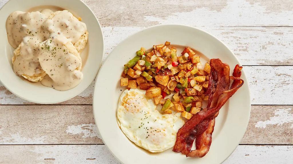 Granny's Biscuits and Homemade Country Gravy · 2 biscuits smothered in creamy sausage bacon country gravy served with 2 eggs, bacon sausage or ham, and crispy country potatoes.