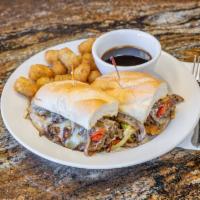Laguna Philly Cheese Steak Sandwich · Choice of thinly sliced tri-tip steak with sauteed onions, bell peppers, smothered with pepp...