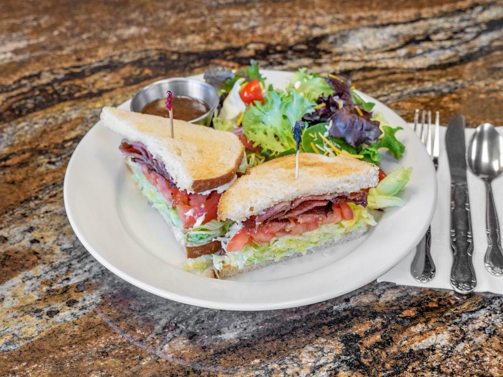 BLT Sandwich · 4 slices of bacon, shredded lettuce, sliced juicy tomatoes, and mayonnaise served on toasted sourdough bread.