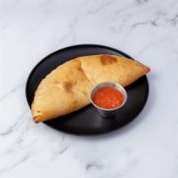 Calzone · Dough stuffed with mozzarella, ricotta cheese and spices served with Marinara Sauce and choi...