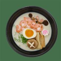 Spicy Tonkotsu Ramen Noodle · Pork bone broth. Come with Green onion, fish cake, egg, bamboo and black garlic oil.  