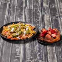 California Skillet · Crisp hashbrowns topped with roasted turkey, avocado, tomato and scrambled eggs drizzled wit...