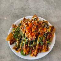 Ahi Poke Nachos · Ahi tuna, krab, spicy tuna, masago, cilantro, jalapeno, freshly fried wonton chips