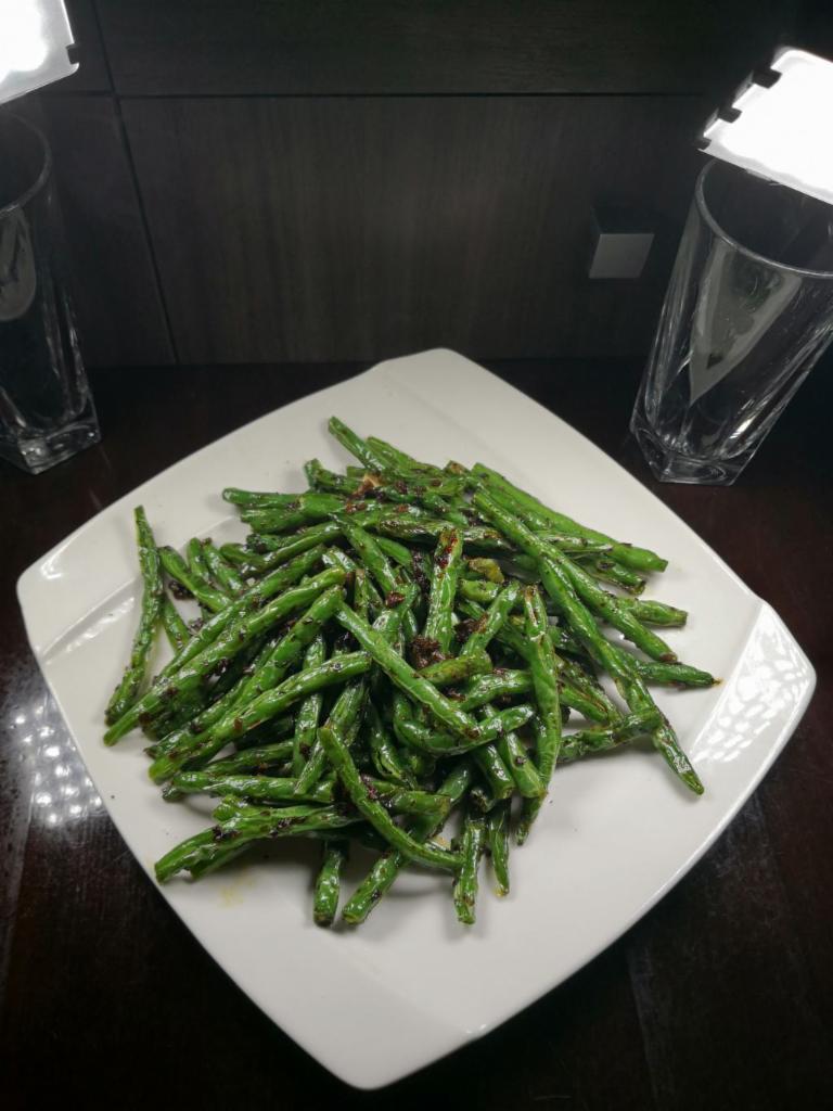 143. Sauteed String Beans · Served with rice.