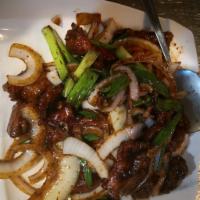 90. Stir Fried Beef with Scallions · Served with rice.