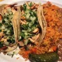 2 Chicken Tacos · Served with rice, beans, salad and tortillas.