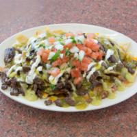 Asada Nachos · Comes with beans, shredded cheese, tomato, onion and cilantro, green salsa, sour cream, and ...