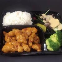 General Gao Chicken Bento Box · A combination of sashimi,California maki,, General Gao chicken, seaweed salad, gyoza and shu...