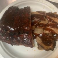 *1/2 Slab W/ Brisket · 1/2 Slab of Pork Ribs & 4 oz of Beef Brisket served with your choice of sauce and 1 side.
