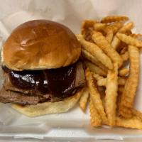 *Beef Brisket Sandwich · 6 oz of Smoked Beef Brisket served on toasted Brioche Roll with your choice of sauce.