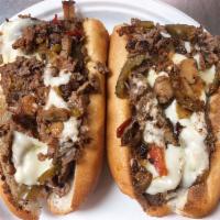 *Lumpy’s Cheesesteak · Chopped seasoned steak topped with mushrooms, fried onions, choice of hot or sweet peppers, ...