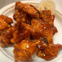 *12 Wings · 12 fried party chicken wings served or coated with your choice of sauce or rub.