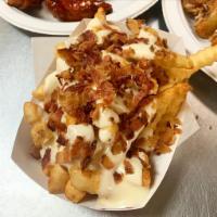 *Bacon Cheese Fries · Topped with American whiz and chopped smoked bacon.