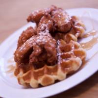 Chicken Wings and Waffles · 6 lightly breaded chicken wings drizzled with syrup over 2 Belgian waffles.