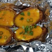 Potato Skins · With bacon, sour cream scallions  and cheddar 4 pcs