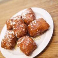 Beignets New Orleans Fried Donuts · 5 golden fried dough puffs dusted with powdered sugar and honey.