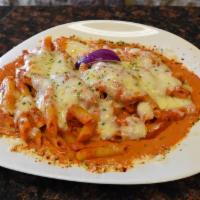 Baked Ziti · Ziti pasta mixed with ricotta cheese and house tomato sauce baked with mozzarella.