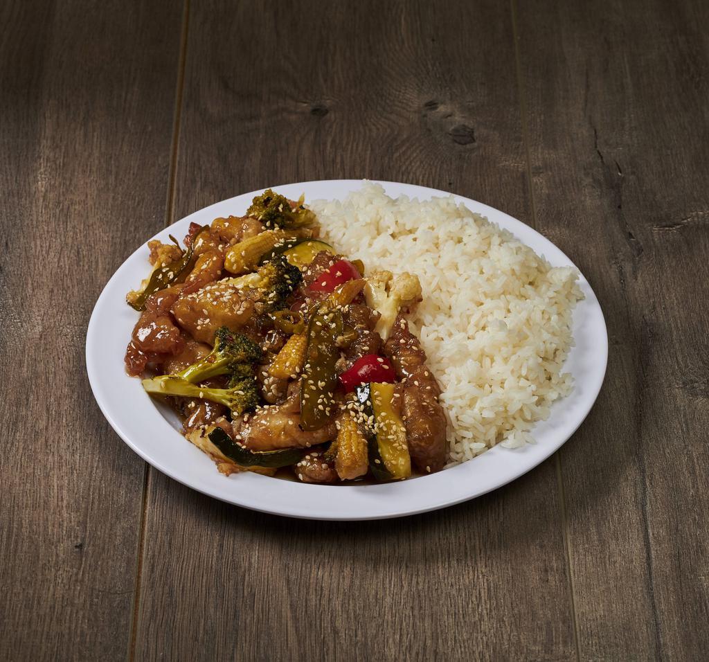 Dinner Sesame Chicken · Deep-fried chicken and vegetables in sweet, tangy sauce. Served with side of rice.