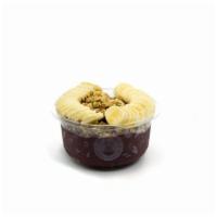 8th Ave · Acai blend topped with banana, granola, and honey.