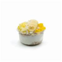 Coconut Craze · Chia seeds and honey coconut blend topped with granola, banana, pineapple, mango, coconut fl...