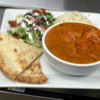 Chicken Tikka Masala Currie · Chicken breast tenders marinated in spice and yogurt, baked in a tandoor oven and cooked in ...