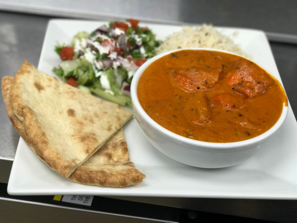 Chicken Tikka Masala Currie · Chicken breast tenders marinated in spice and yogurt, baked in a tandoor oven and cooked in a tomato based creamy sauce.