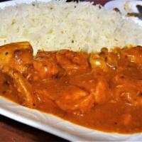 Tandoori Shrimp Korma Currie · 6 Jumbo shrimp cooked with spices and butter sauce. Served with salad , rice and Naan.