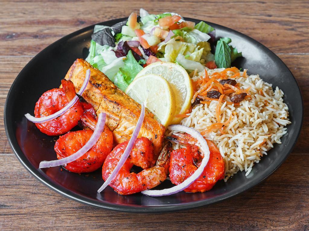 Salmon and Tandoori Shrimp Combo · fresh marinated Grilled Salmon fillet and 4 pieces of jumbo shrimp marinated in afghan spices and herbs.
served with tandoori bread, rice, salad and cilantro yogurt sauce.
