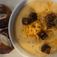 Beer Cheese Soup (Vegetarian) · Smoked German Wheat Beer, Cheddar, Croutons with House Pretzel Rolls.