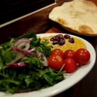Hummus and House Made Flat Bread (Vegetarian) · Olives, cucumbers, tomatoes, onions, arugula, zaatar, feta. Vegetarian.