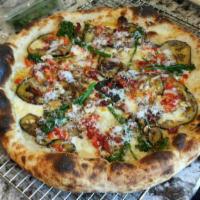 Veggie Pizza · Featuring sweet fontal, eggplant, sun-dried tomatoes, roasted peppers, mushrooms and broccol...