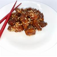 Sesame Chicken · Wok-fried chicken tossed in a sweet brown sugar glaze, topped with sesame seeds.
